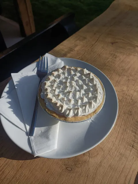 Lemon meringue pie with golden torched peaks