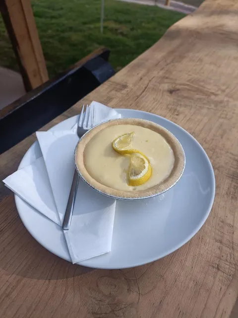 Lemon tart with curd filling and a twist of fresh lemon