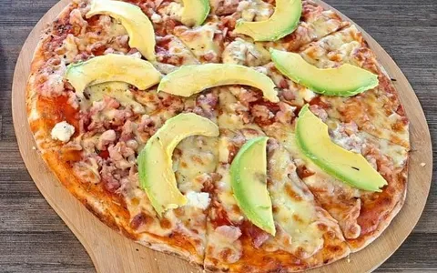 Stone-baked avocado and bacon pizza